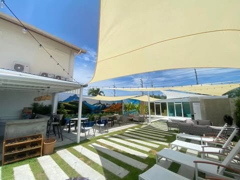 The clubhouse bar and the garden with sun loungers