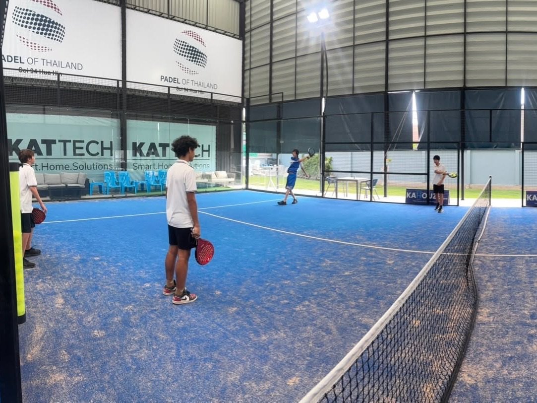 Junior players in a school session on court
