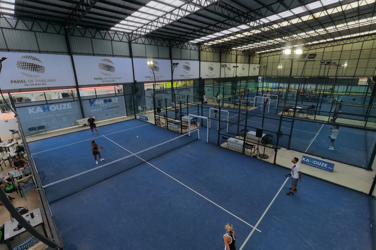 The four covered courts and the lounge, seen from the drone
